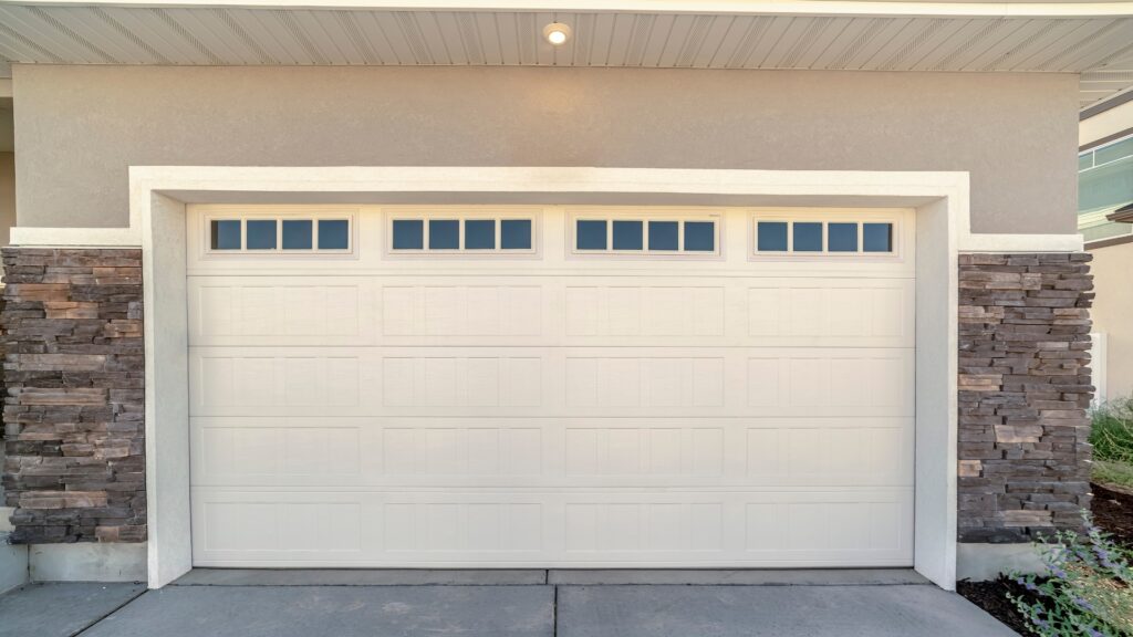 garage door maintenance A garage door with window inserts. Garage door window maintenance is essential in keeping their aesthetics