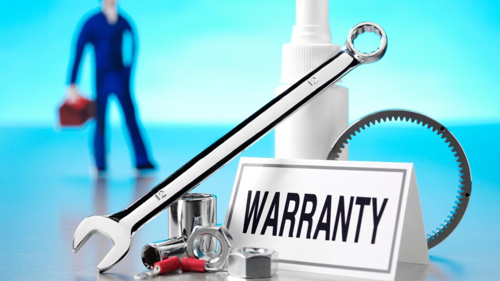 Garage Door Repair Moline IL - Titan Garage Doors Quad Cities - Why You Should Care About Your Garage Door Warranty A warranty sign among repair tools