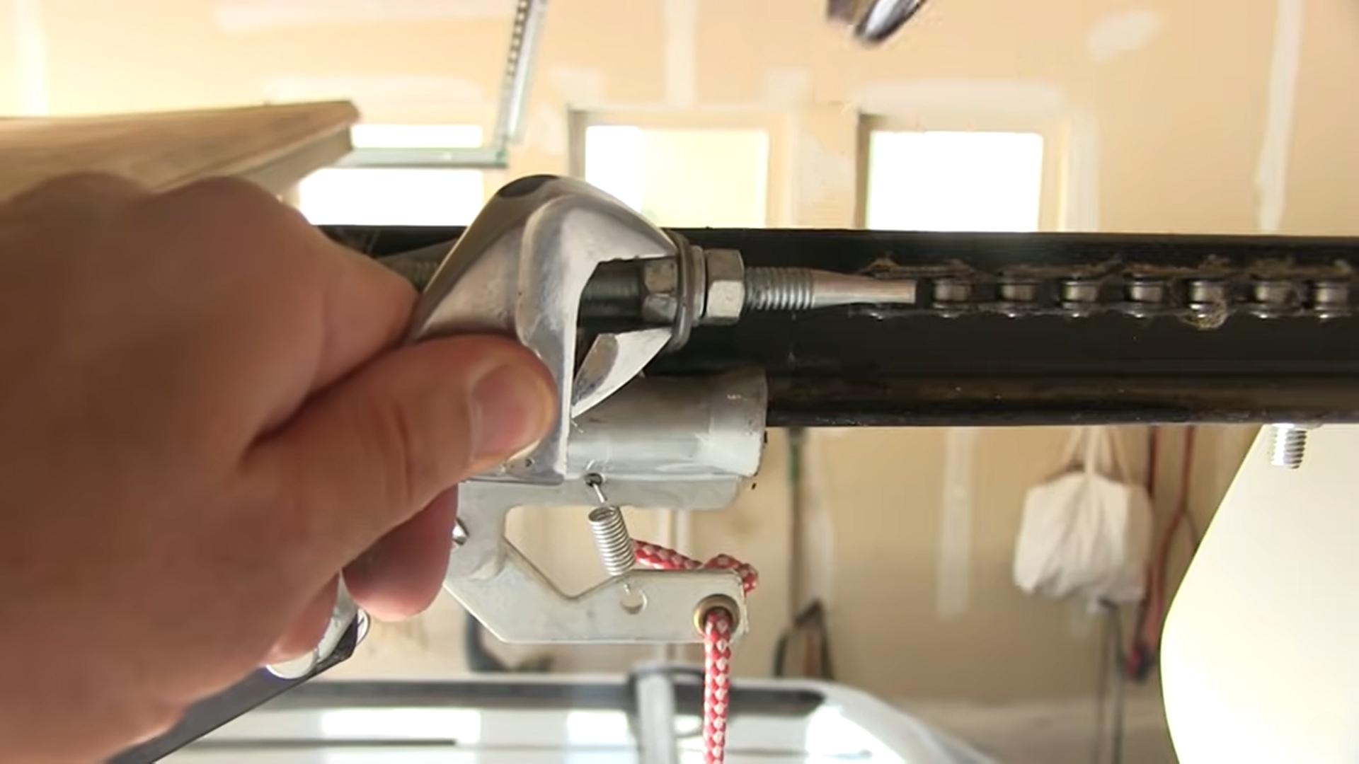 Titan-Garage-Doors-Quad-Cities-Garage-Door-Opener-Maintenance_-Tips-and-Tricks-Tighten-all-loose-hardware