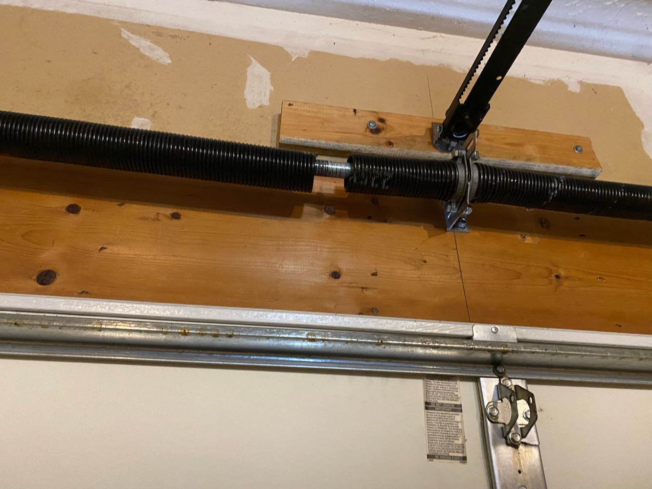 garage door spring replacement broken torsion spring Garage Door Maintenance garage door repair garage door service Garage Door Spring Replacement Bettendorf