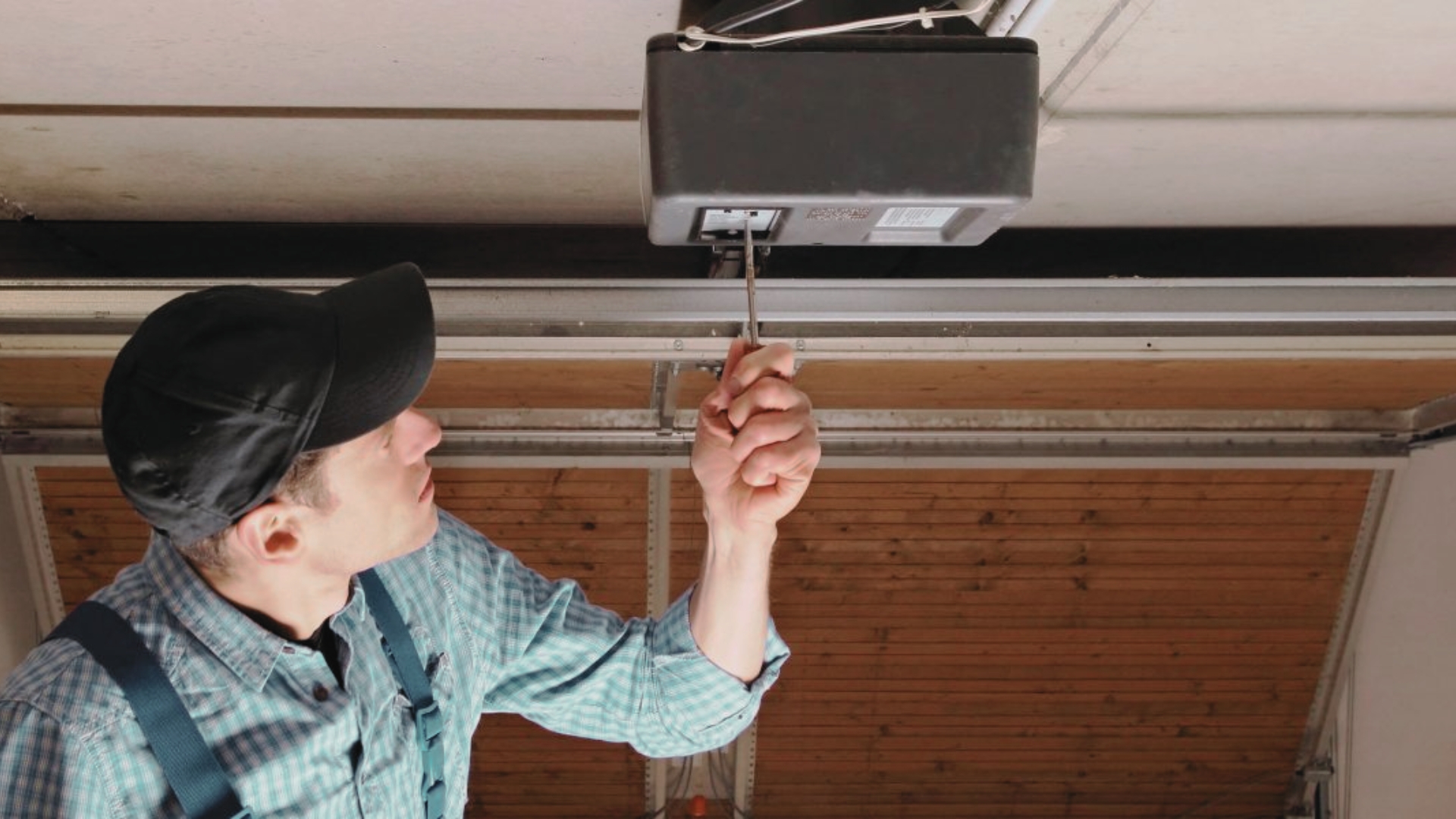 Technician resetting the opener when the garage door won't open.